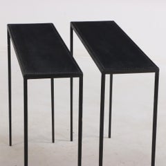 A pair of leather & iron tables in the style of Jean-Michel Frank. Contemporary.