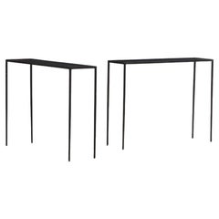 A pair of leather & iron tables in the style of Jean-Michel Frank. Contemporary.