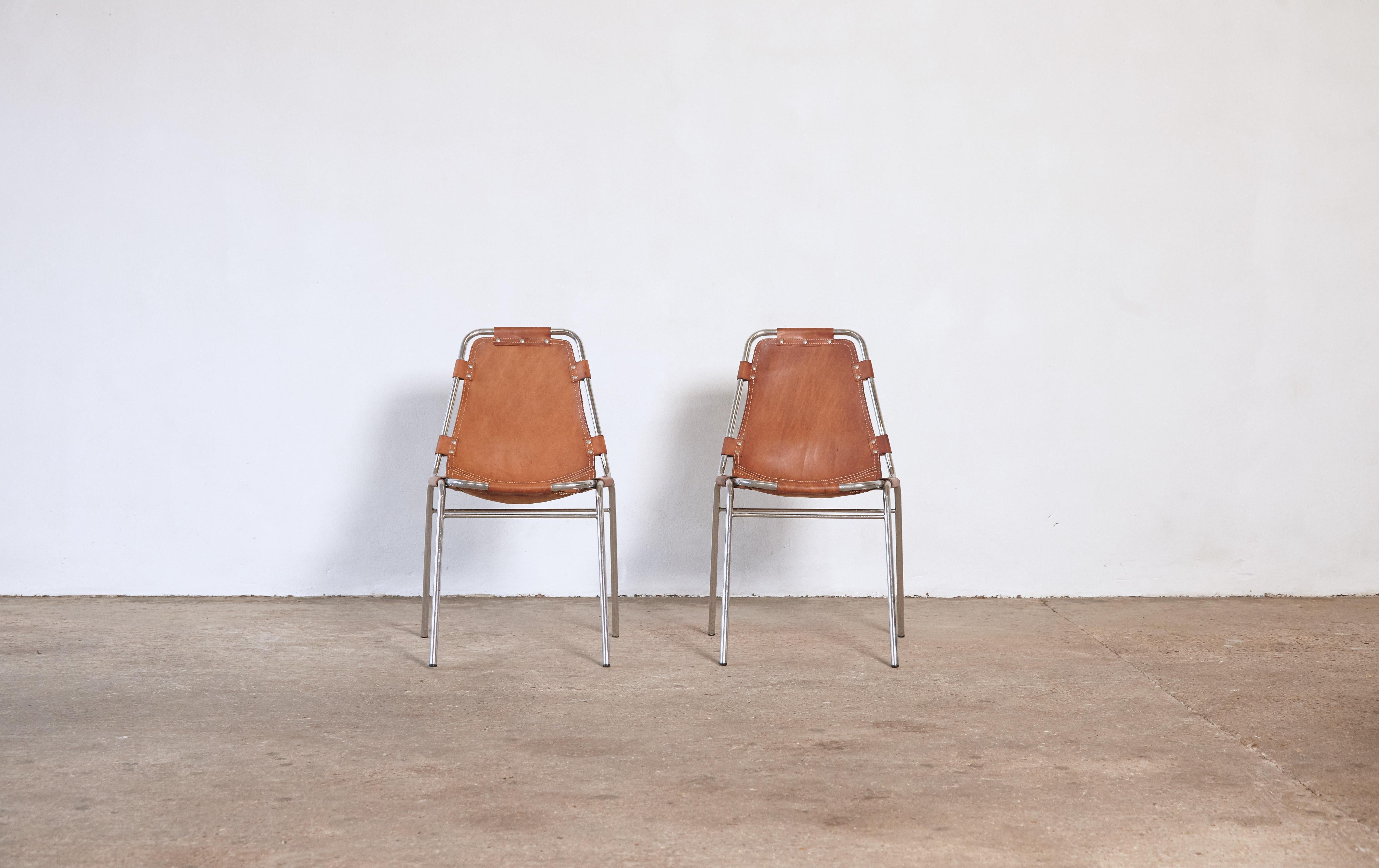 A very nice pair of 'Les Arcs' chairs in tubular steel and cognac leather, France/Italy, 1970s.

Les Arcs was a project on which Charlotte Perriand collaborated with some other architects who developed the interiors as well. These chairs are often