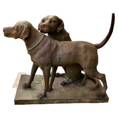 A Pair of Life-size Labradors/ Weathered Cast Iron Statue on a Plinth