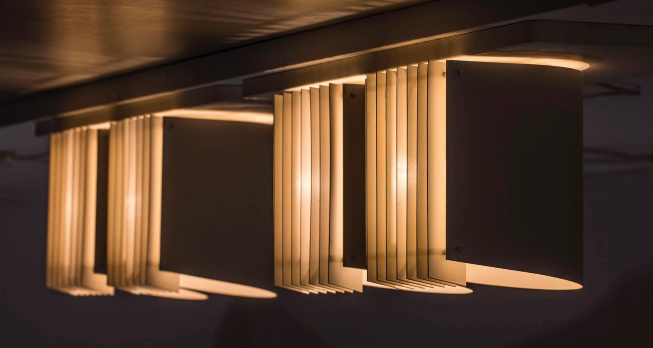 A pair of rare, custom order flush mount lights designed by Alvar Aalto for Itsu, Model 