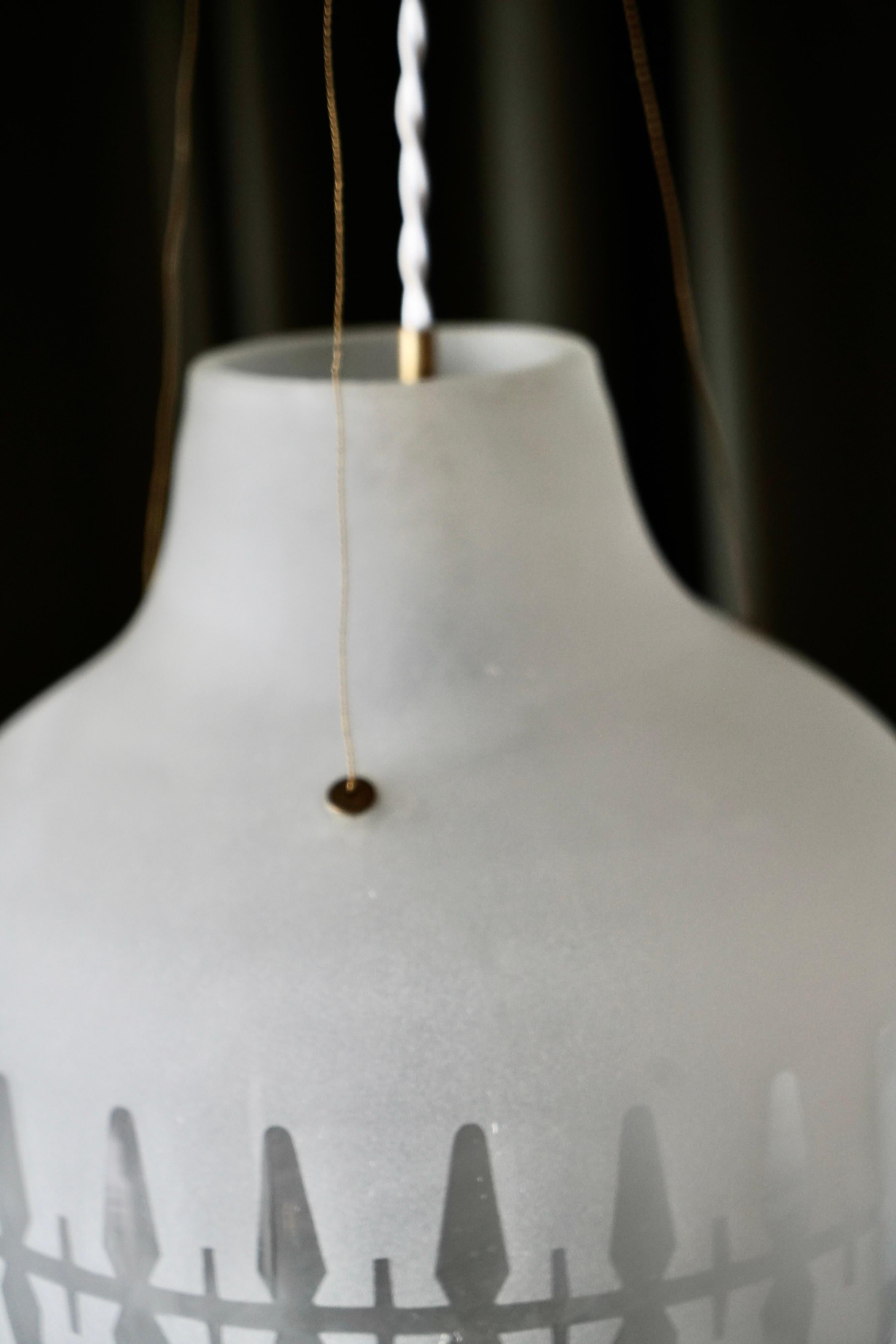 A pair of lighting pendant by Harald Notini for Arvid Böhlmarks Lampfabrik In Good Condition For Sale In Long Island City, NY