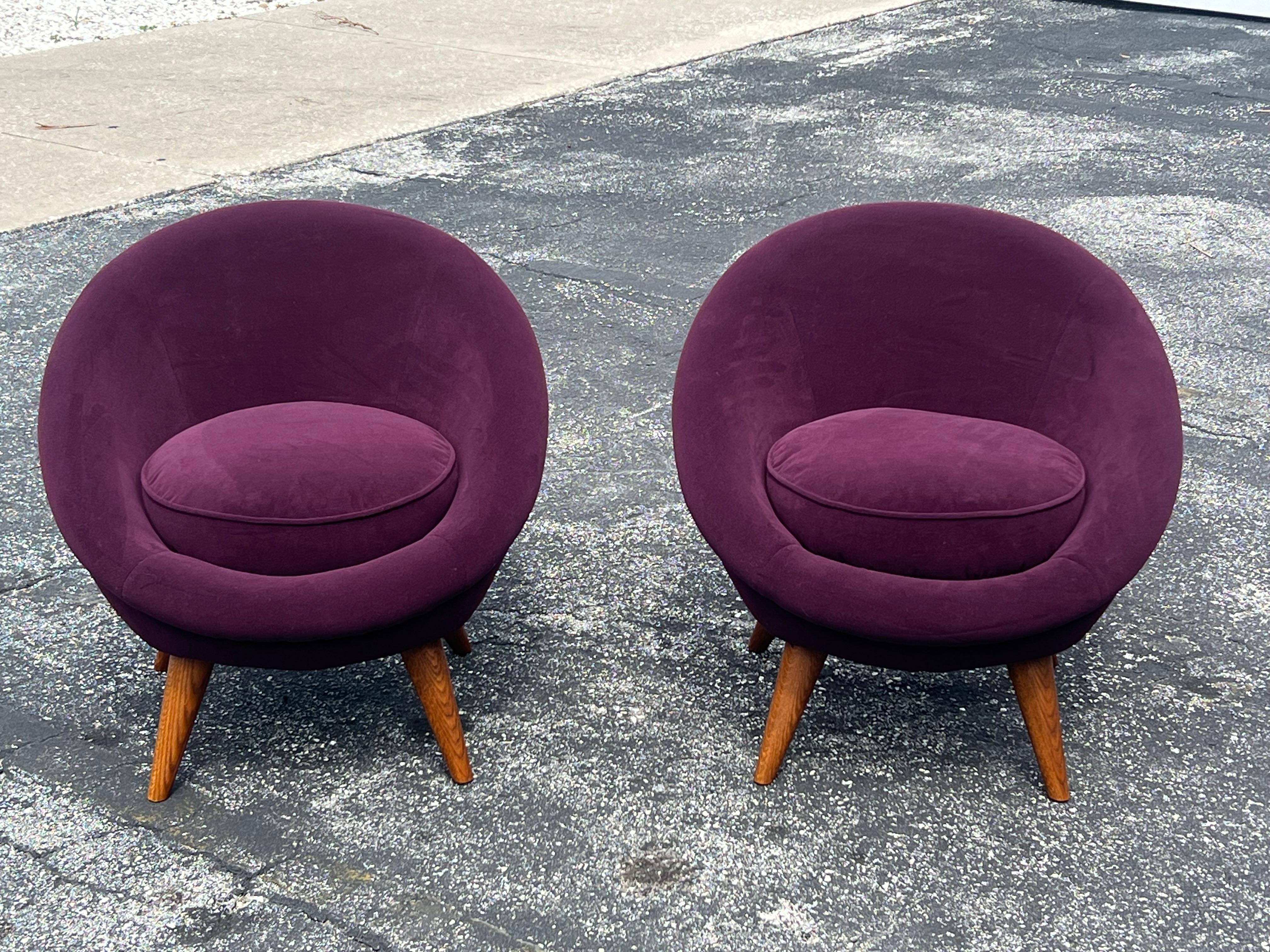 A great pair of petite egg chairs. Oak frames, reupholstered in purple velvet fabric.