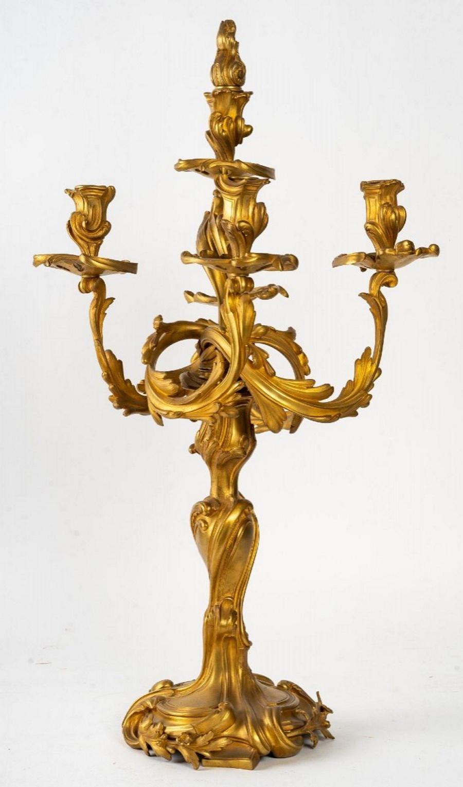 A pair of Louis XV style gilt bronze candelabras, 19th century
Measures: H: 67 cm, W: 32 cm, D: 29 cm.