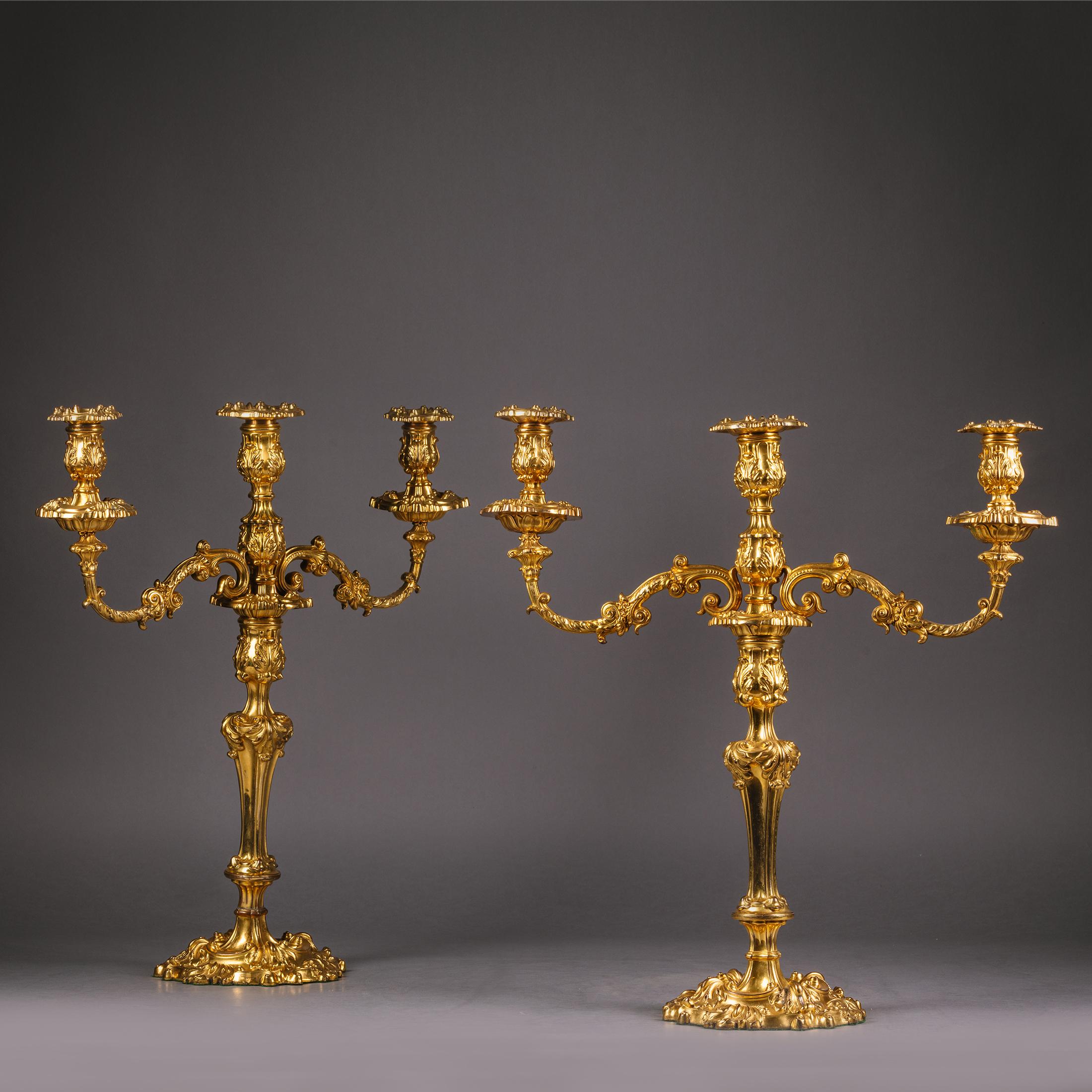 A Pair of Louis XV Style Rococo Revival Ormolu Three-Light Candelabra.

Finely cast in the Rococo Revival style this fine pair of English candelabra have baluster stems and scrolling acanthus wrapped branches terminating in circular dip trays and