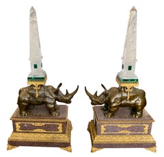 A Pair of Louis XVI Style Bronze Rhinoceros Figures with Rock Crystal Obelisks