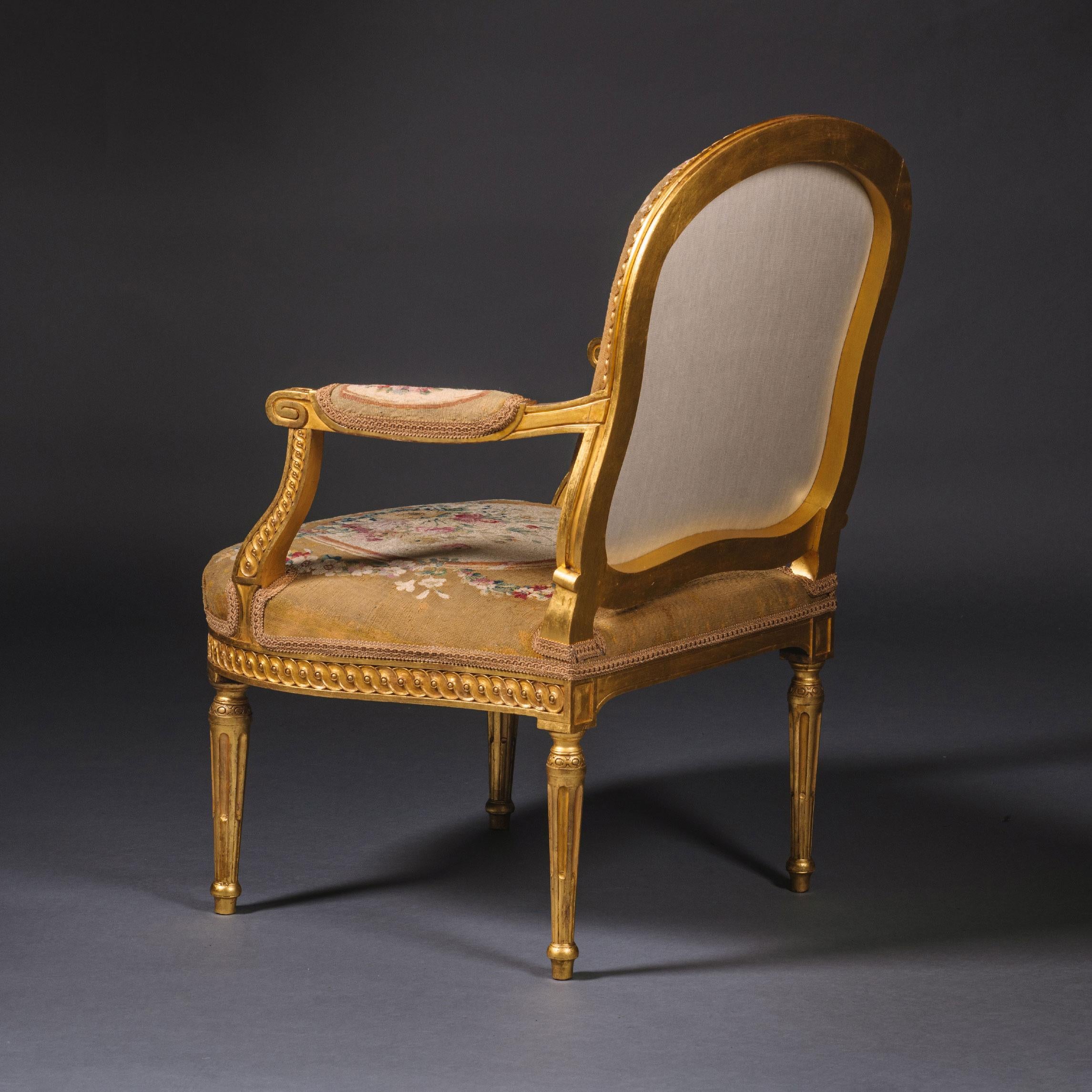 19th Century Pair of Louis XVI Style Giltwood and Tapestry Fauteuils For Sale