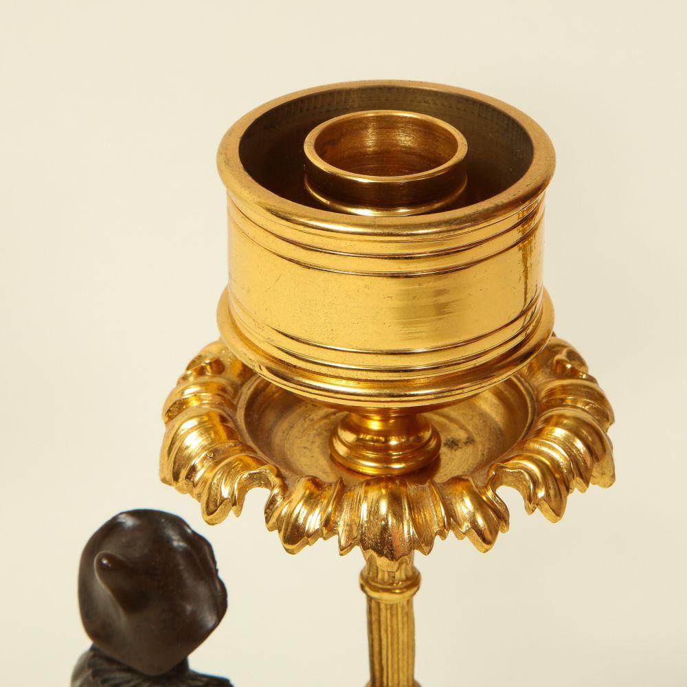 Pair of Louis XVI Style Harlequin Figural Bronze and Gilt-Bronze Candlesticks For Sale 1
