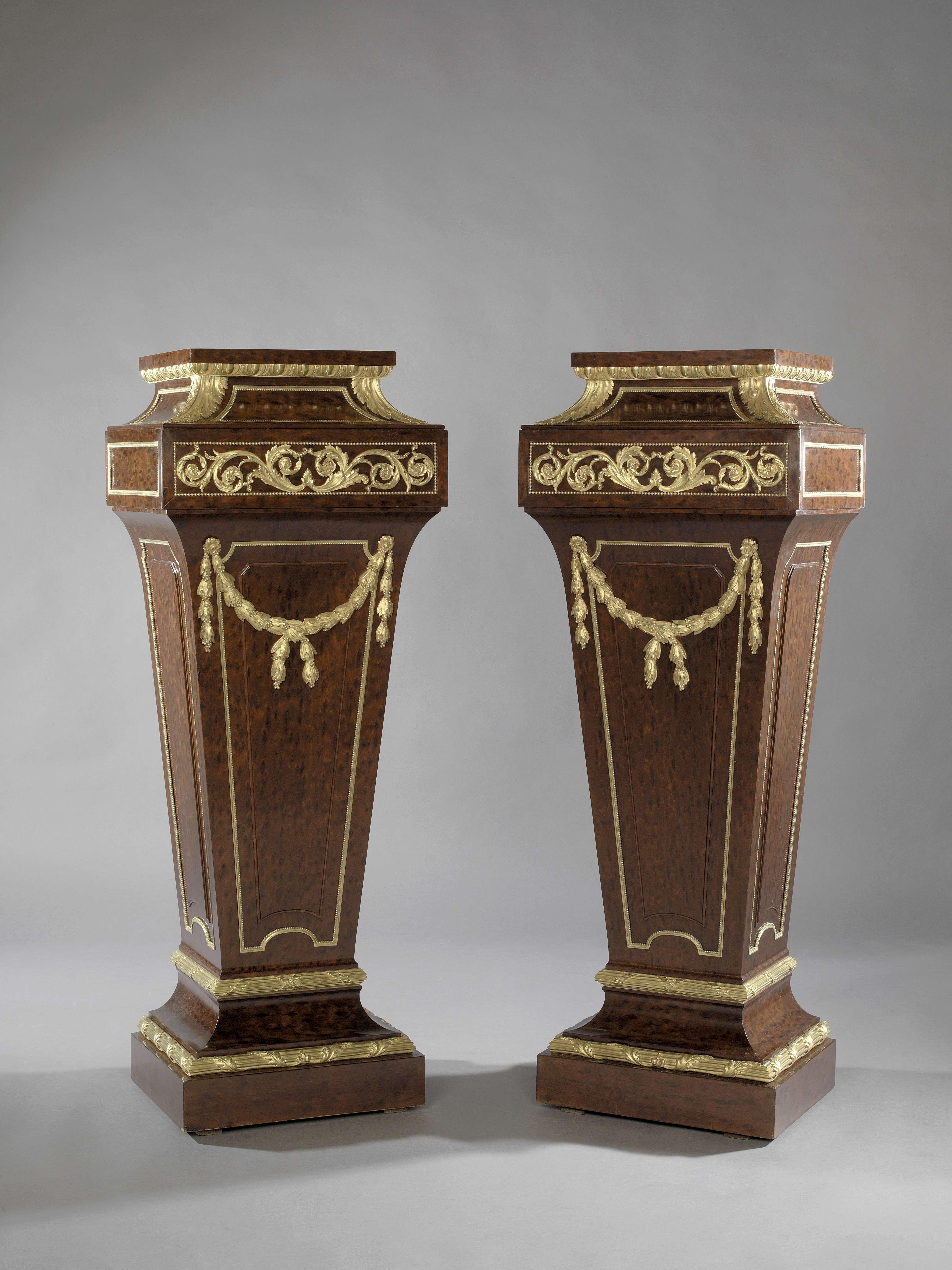 A very fine pair of Louis XVI Style gilt bronze mounted mahogany pedestals, attributed to Sormani. 

French, circa 1870.

The pedestals are of tapering form with finely chiselled gilt bronze mounts of bell husk swags and scrolling acanthus