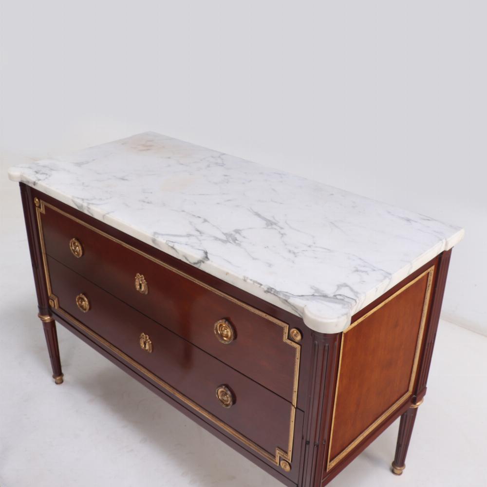A Pair of Louis XVI style marble top mahogany commodes, signed Jansen, C 1940. For Sale 4