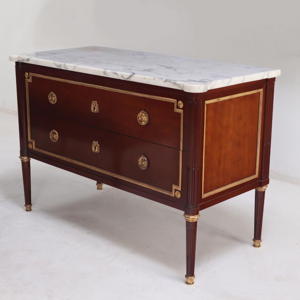 These signed Maison Jansen Marble top Commodes / Dressers are exceptional pieces of furniture. The matching pieces each with a shaped white beveled marble top resting on a case with two bronze framed drawers flanked by bronze framed sides with