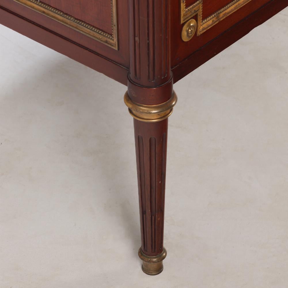 A Pair of Louis XVI style marble top mahogany commodes, signed Jansen, C 1940. For Sale 2