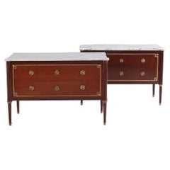 Antique A Pair of Louis XVI style marble top mahogany commodes, signed Jansen, C 1940.