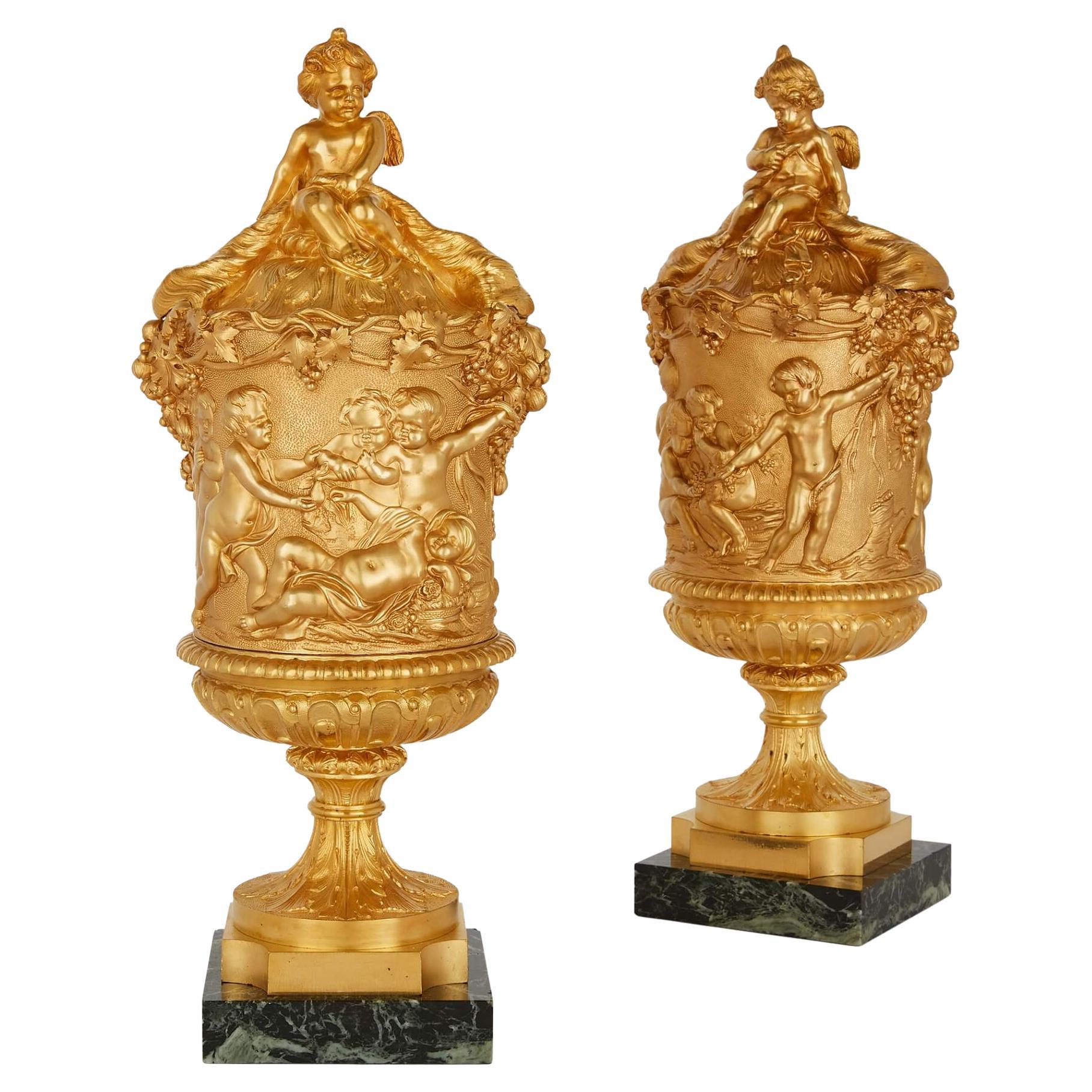 Pair of Louis XVI Style Ormolu Lidded Urns, Designs in the Style of Clodion