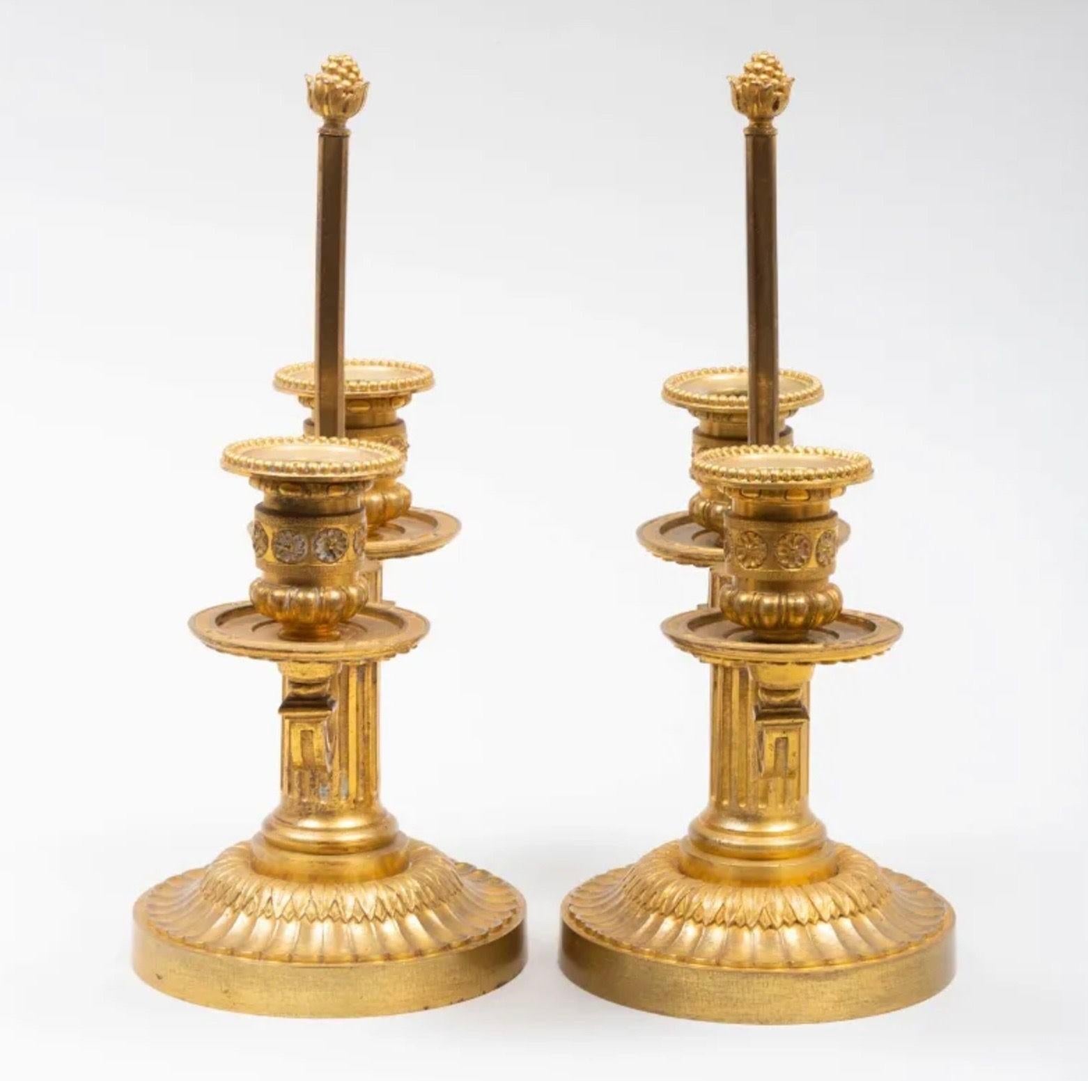 Cast A Pair of Louis XVI Style Two-Light Ormolu Candlesticks For Sale