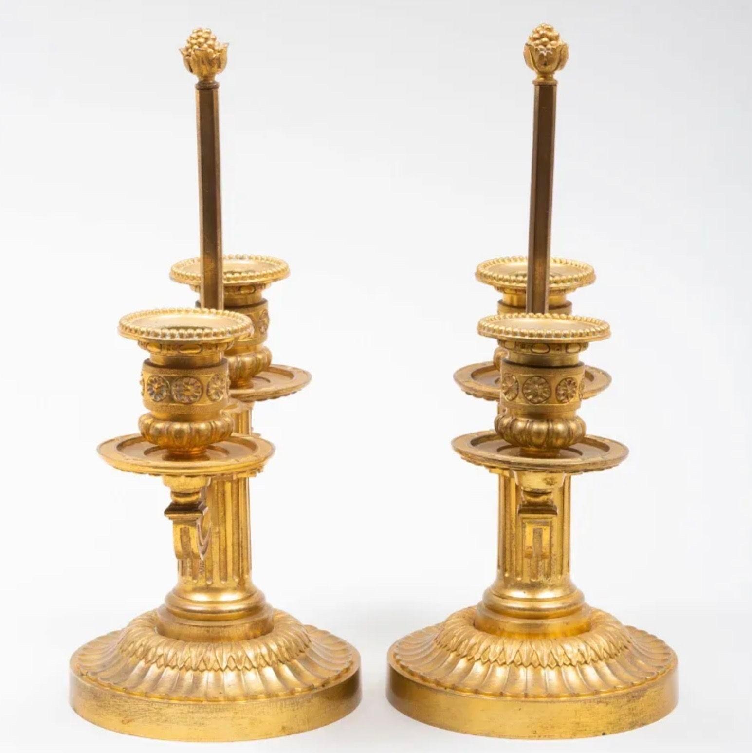 20th Century A Pair of Louis XVI Style Two-Light Ormolu Candlesticks For Sale