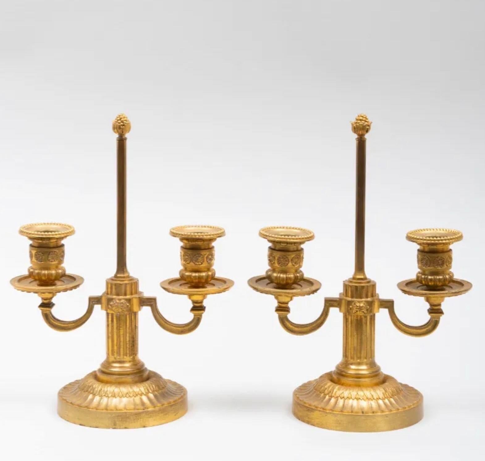 A Pair of Louis XVI Style Two-Light Ormolu Candlesticks For Sale 1