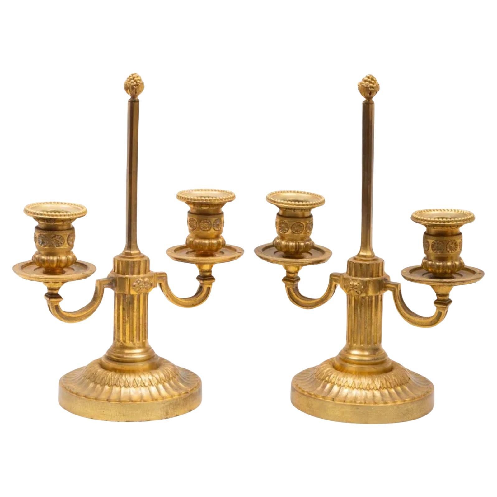 A Pair of Louis XVI Style Two-Light Ormolu Candlesticks For Sale