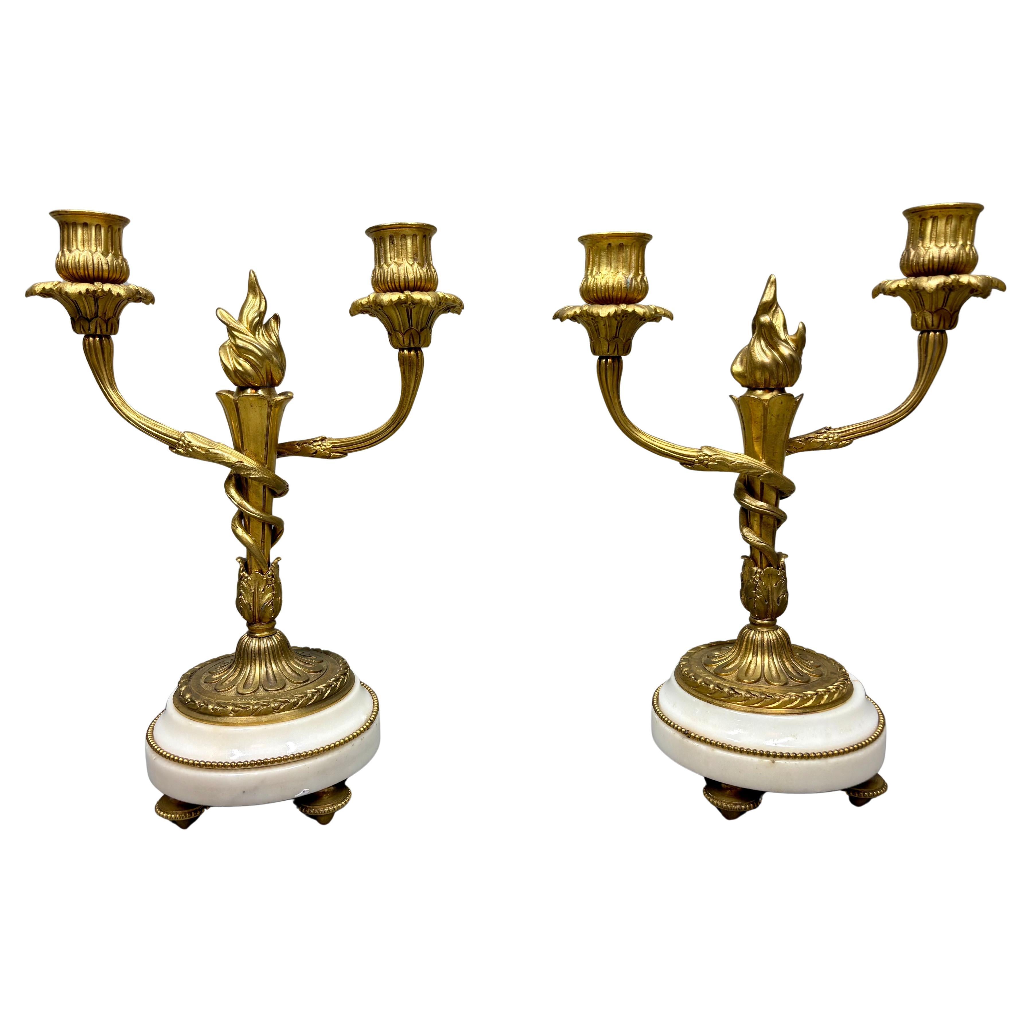 A pair of Louis XVI style two-light ormolu & marble candelabra signed Millet