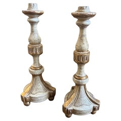 A pair of Louis XVI White and Gold Lacquered Wood Sicilian Candlesticks