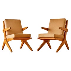 A pair of lounge chairs attributed to Lina Bo Bardi