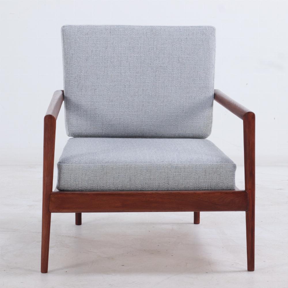 A pair of lounge chairs with Windsor backs designed by Edmund Spence. 2