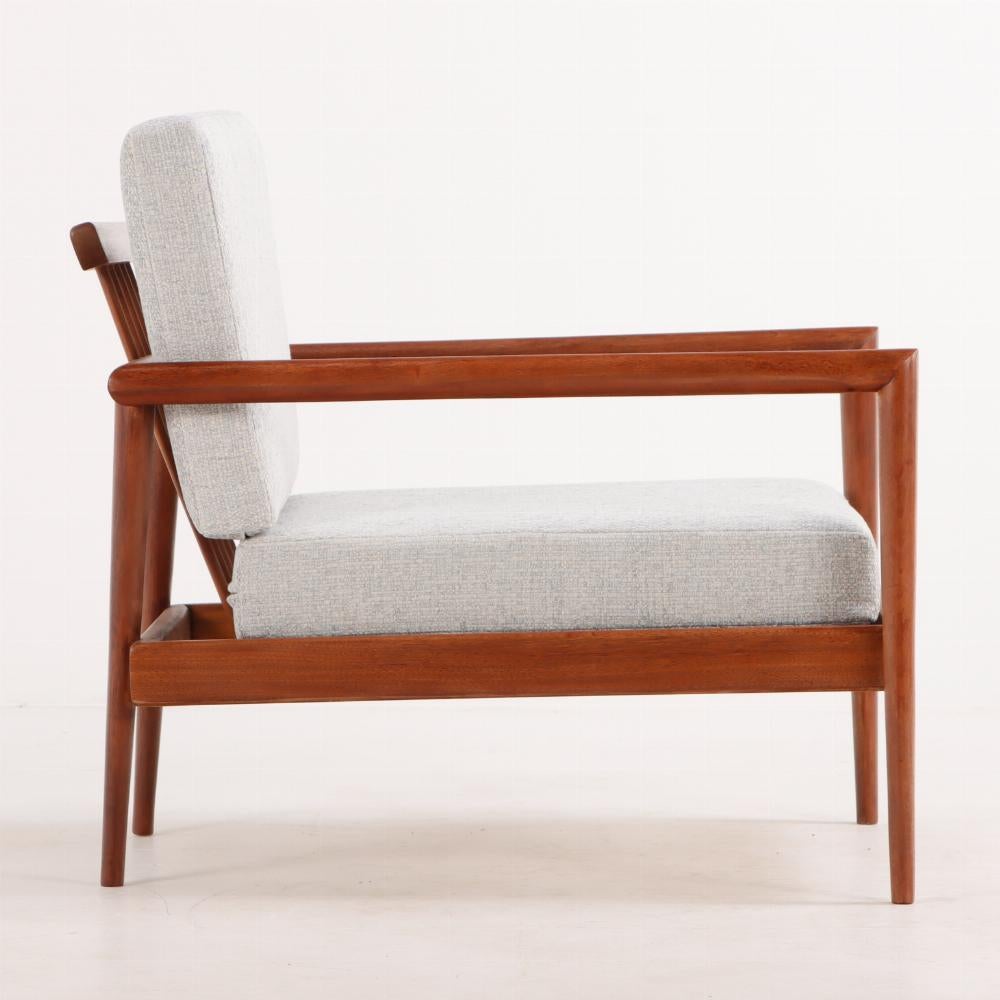 Mid-Century Modern A pair of lounge chairs with Windsor backs designed by Edmund Spence.
