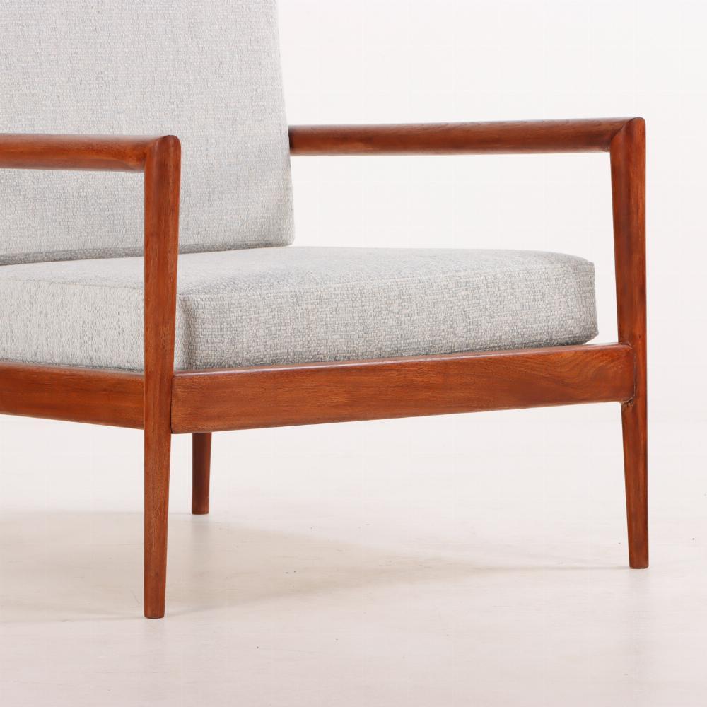 American A pair of lounge chairs with Windsor backs designed by Edmund Spence.