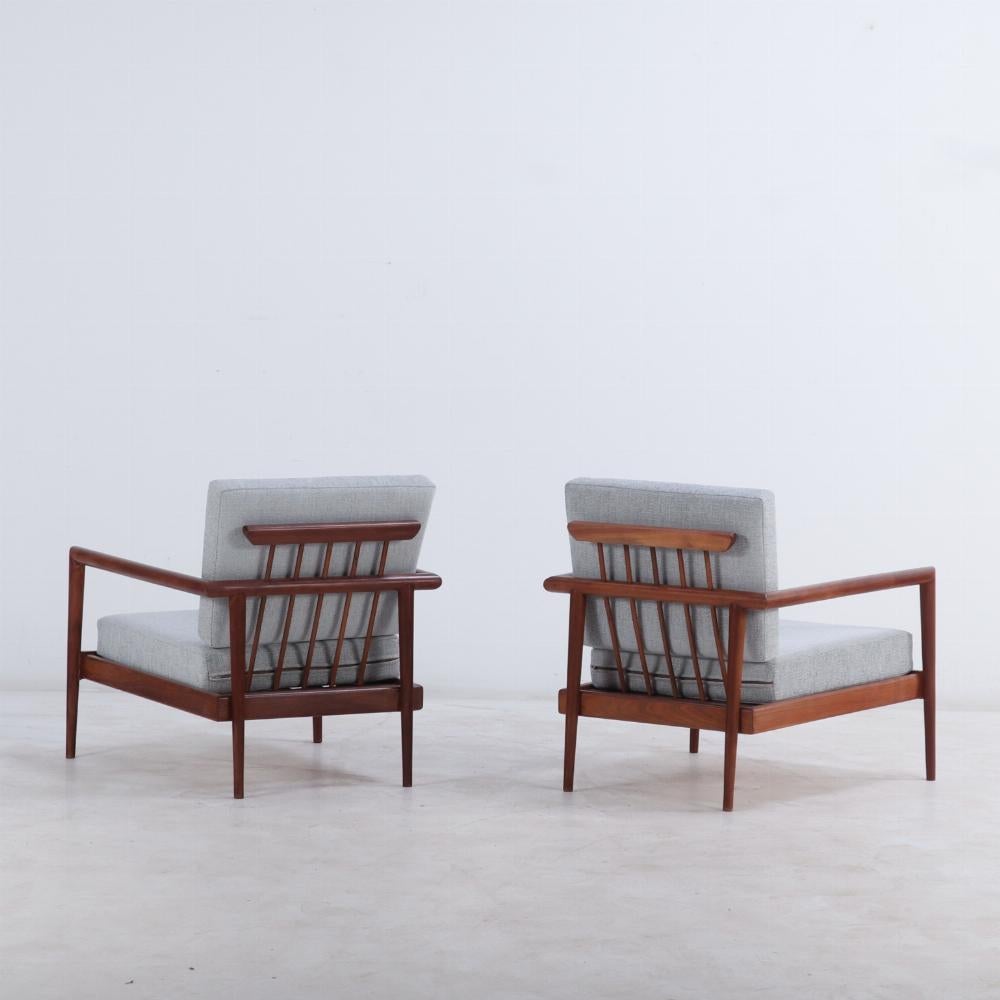 20th Century A pair of lounge chairs with Windsor backs designed by Edmund Spence.
