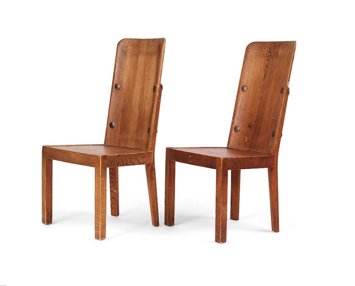 A set of 2 stained pine  “Lovö” chairs designed by Axel Einar Hjorth  for Nordiska Kompaniet, Sweden, 1930s. 