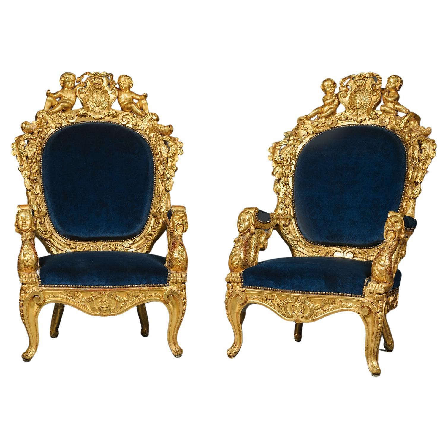 A Pair of Magnificent Giltwood Armchairs