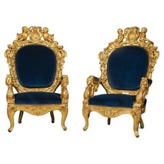 Paire de magnifiques fauteuils en bois doré