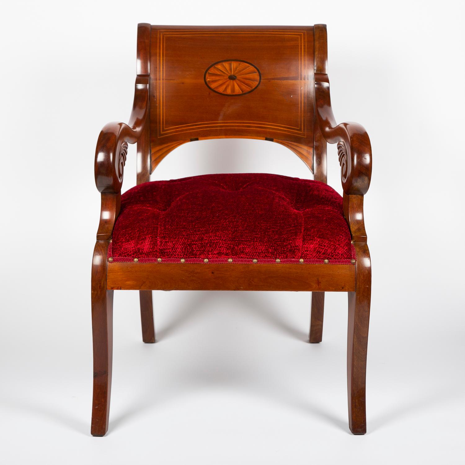 A pair of mid-19th century mahogany armchairs with carved and inlaid decoration, Denmark, circa 1860.

Upholstered in ruby red deep buttoned cotton chenille fabric.