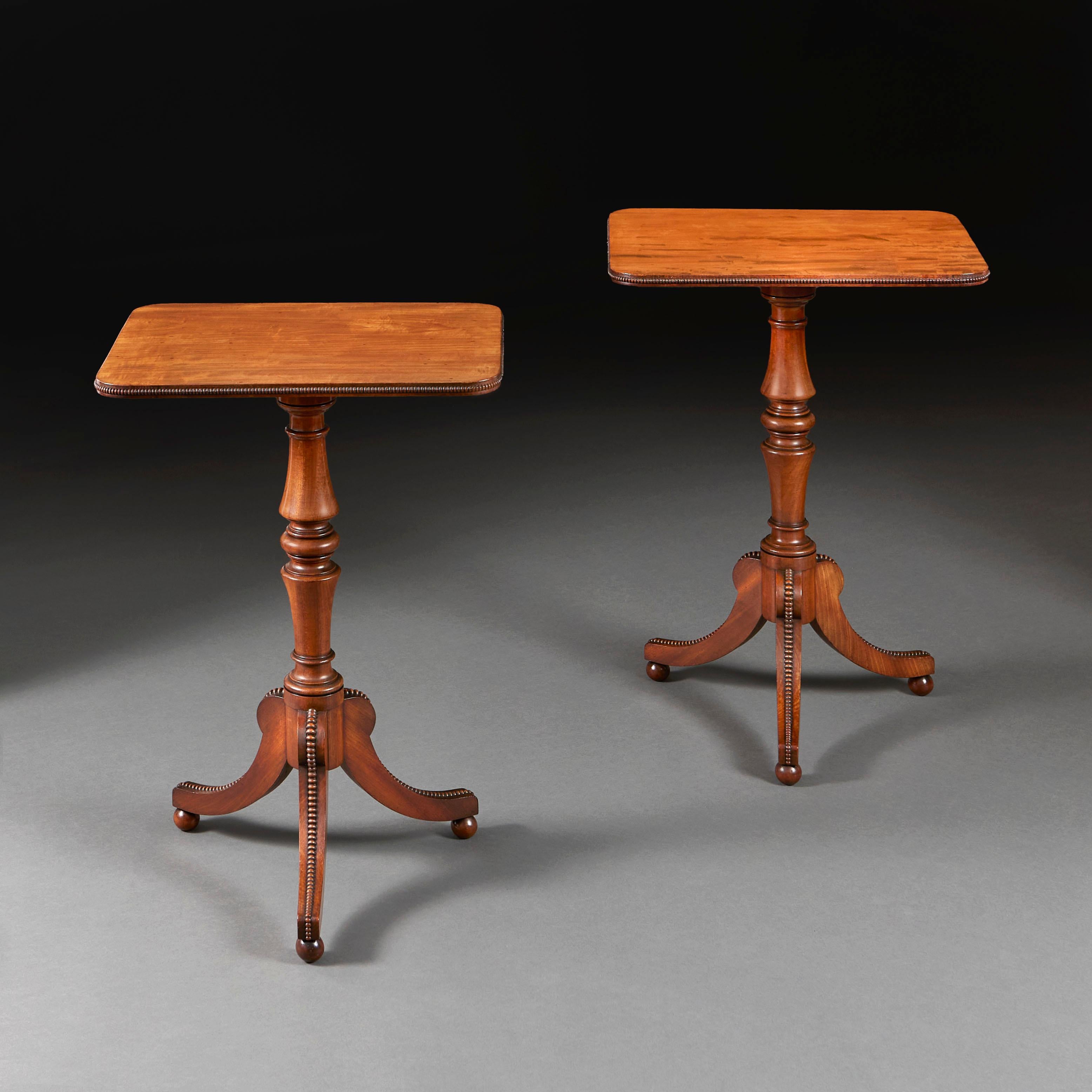 England, circa 1820

A fine pair of mahogany occasional tables, with finely figured rectangular tops, the edges with cock beading, turned gun barrel pedestal, supported on tripod splayed feet, also decorated with cock beading. Attributed to Gillows