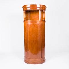 A pair of mahogany oval cabinets, Denmark, circa 1910.