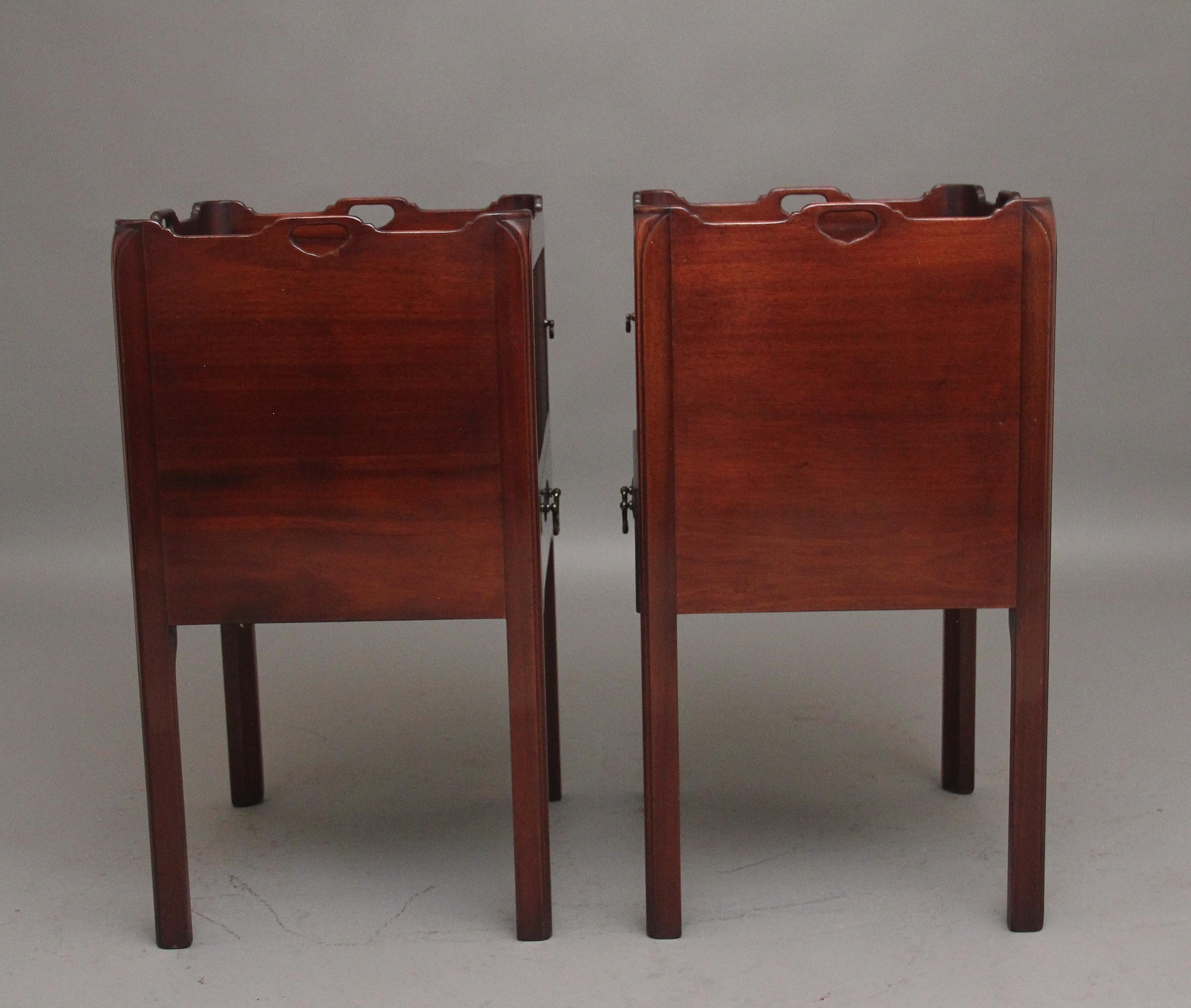 Mahogany A pair of mahogany tray top bedside cabinets in the Georgian style For Sale