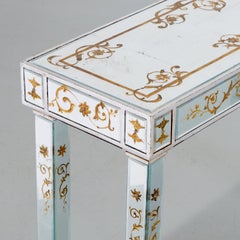 A Pair of Maison Jansen Style Verre Églomisé Consoles with Gilt Floral Scrolls