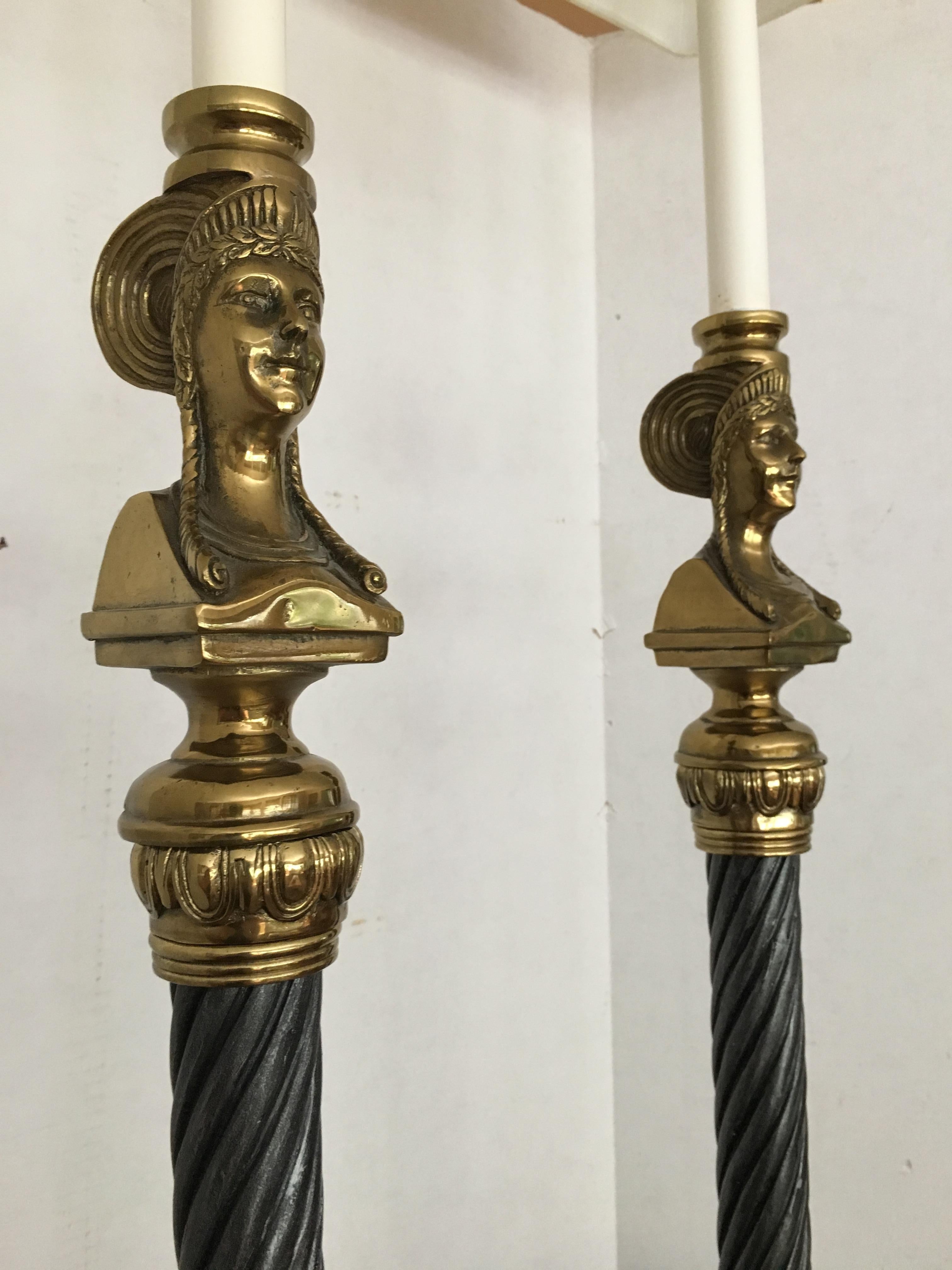 A pair of Maitland Smith brass figural lamps with marble bases and twisted metal rods.