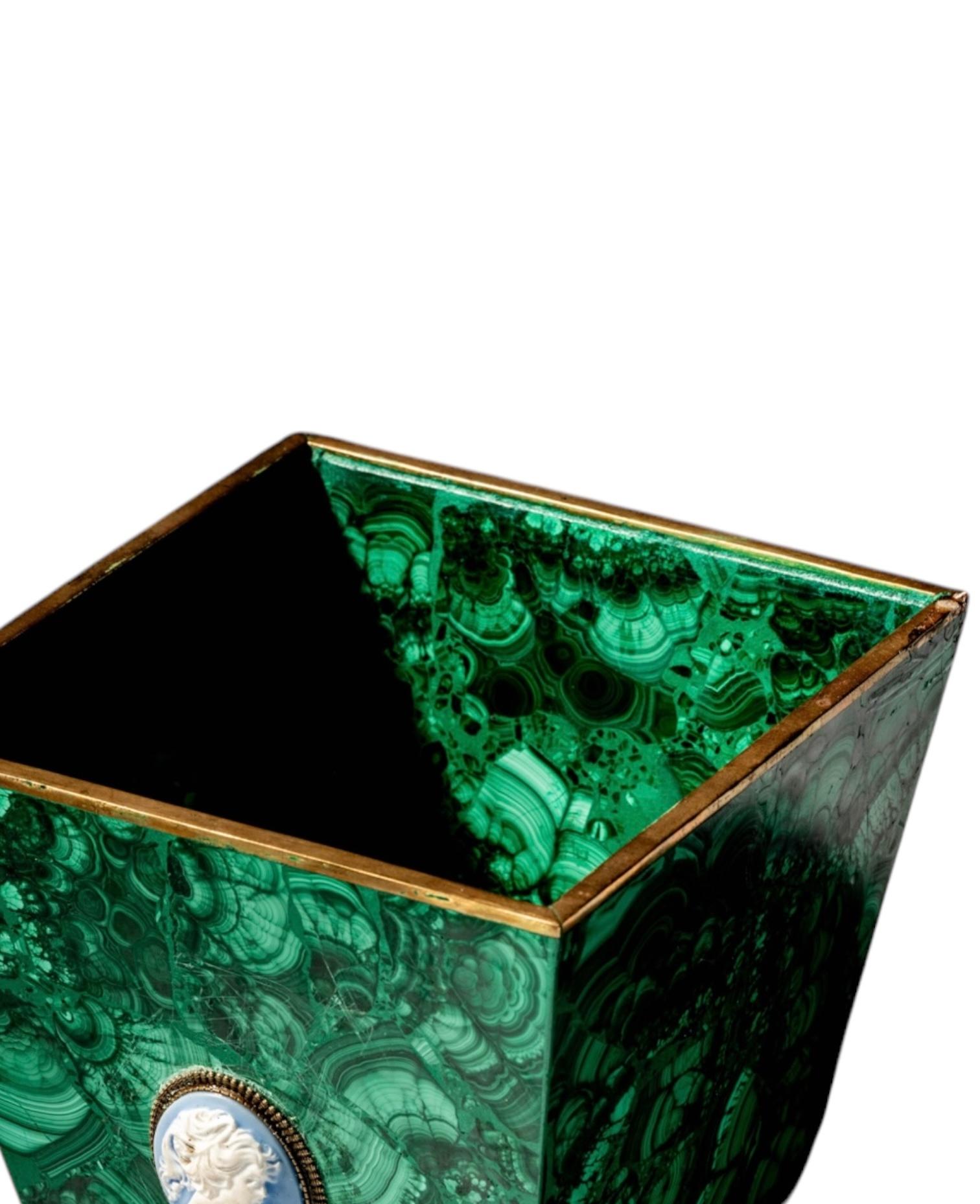 Add a touch of luxury and elegance to your space with this Malachite Square Planter. Crafted from exquisite malachite, this planter showcase the stone’s signature rich green hues and mesmerizing natural patterns, making it a striking statement piece