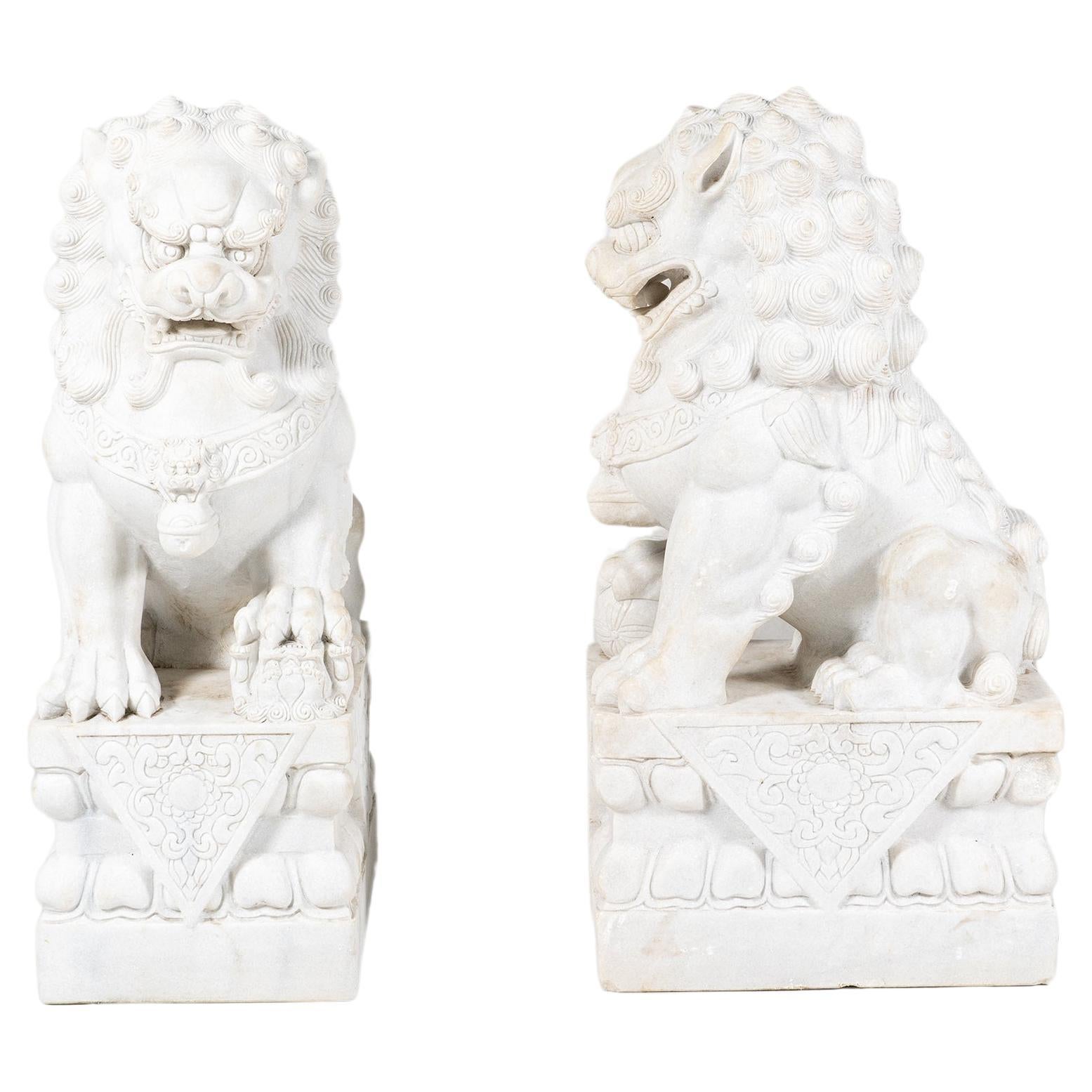The large pair of marble Chinese Fu Lions exemplifies traditional Chinese craftsmanship and symbolism. These majestic lion statues (also known as 