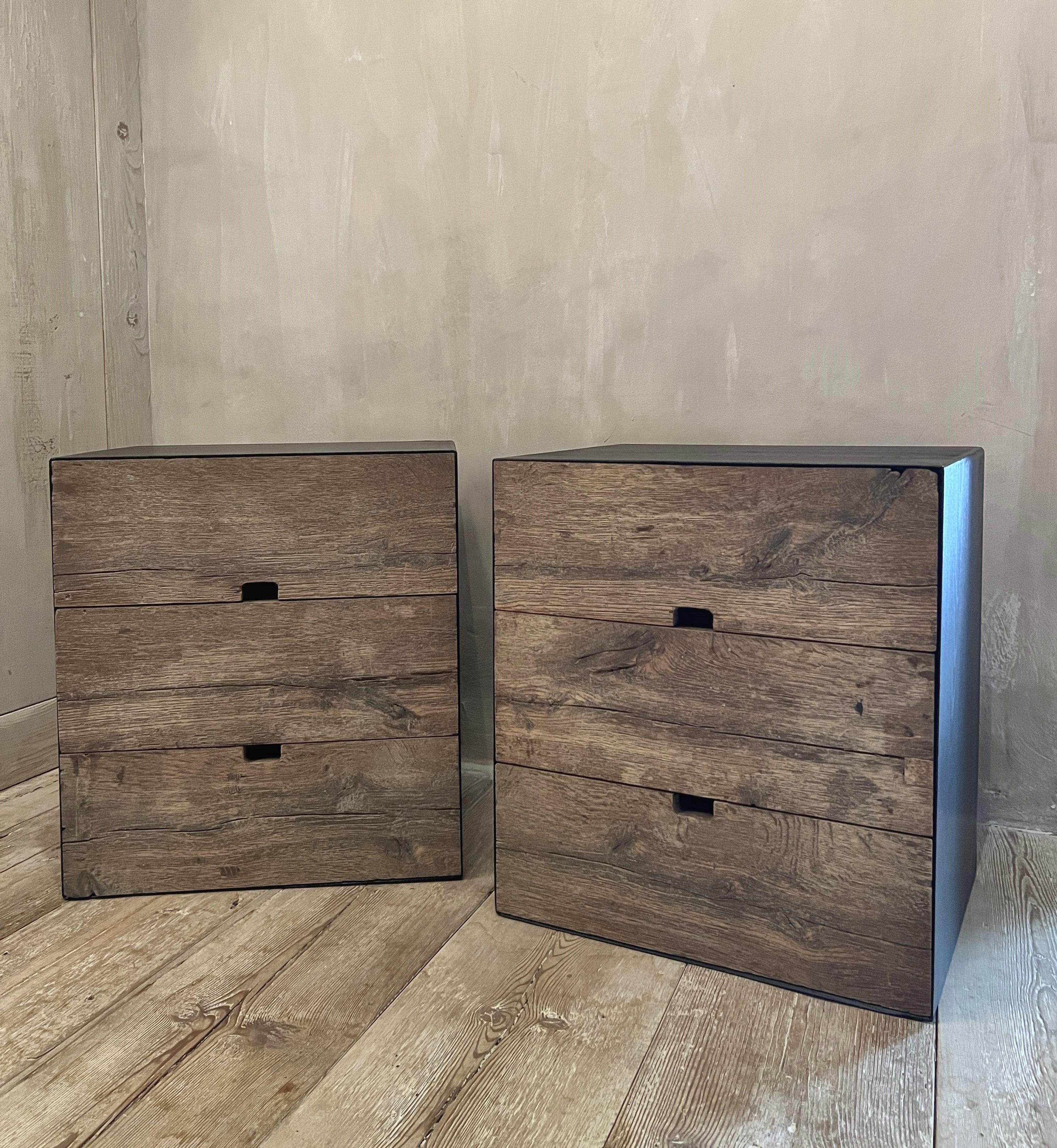 A pair of nightstands, model MARTIN, completely made of 18th century French oak wainscot. The drawer fronts in natural patina and the rest of the piece stained in burned satin black.