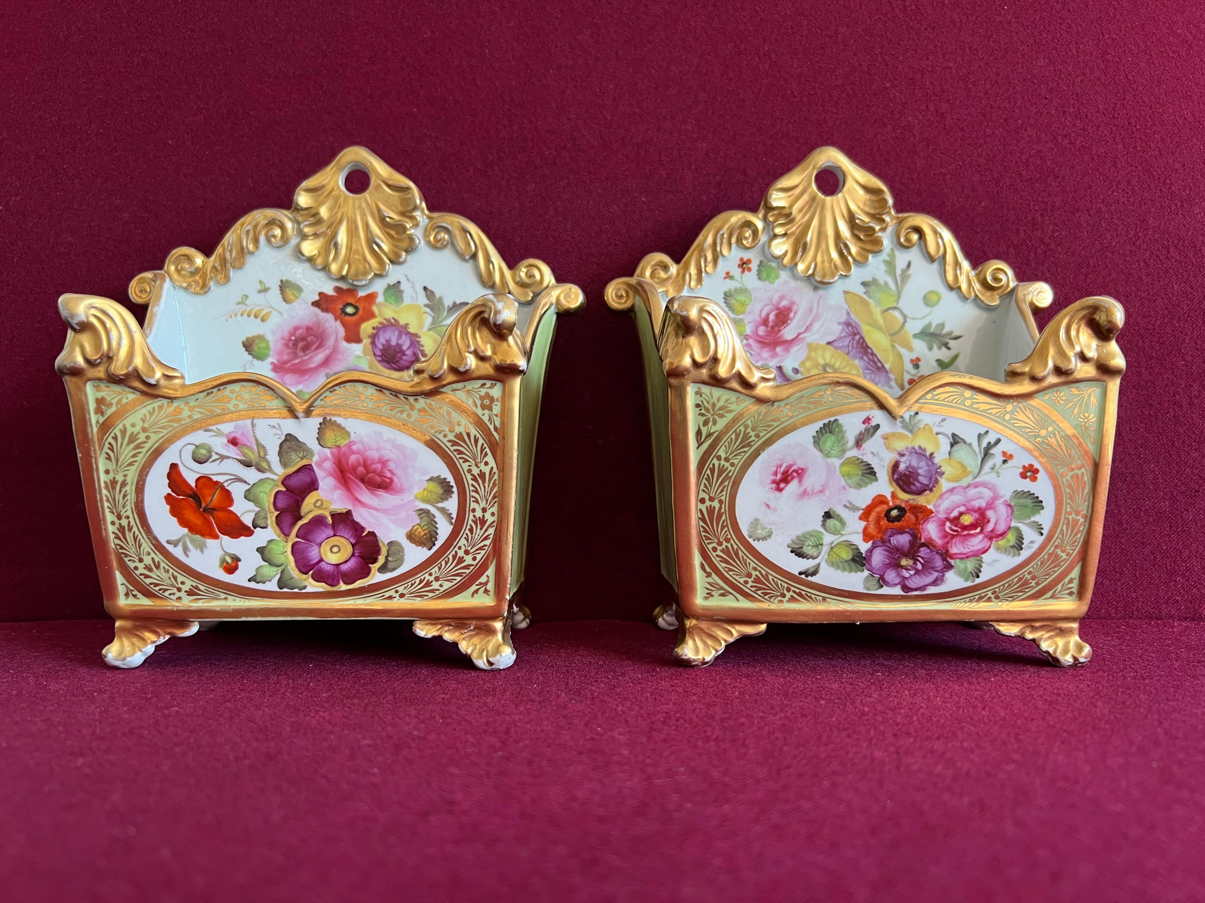 A pair of Mason's Ironstone China Card Racks c.1820-1825.  Finely decorated with bouquets of summer flowers with a sage green ground and gilding. Impressed mark 'Mason's Ironstone China' to the base of one. These letter racks are mentioned in the