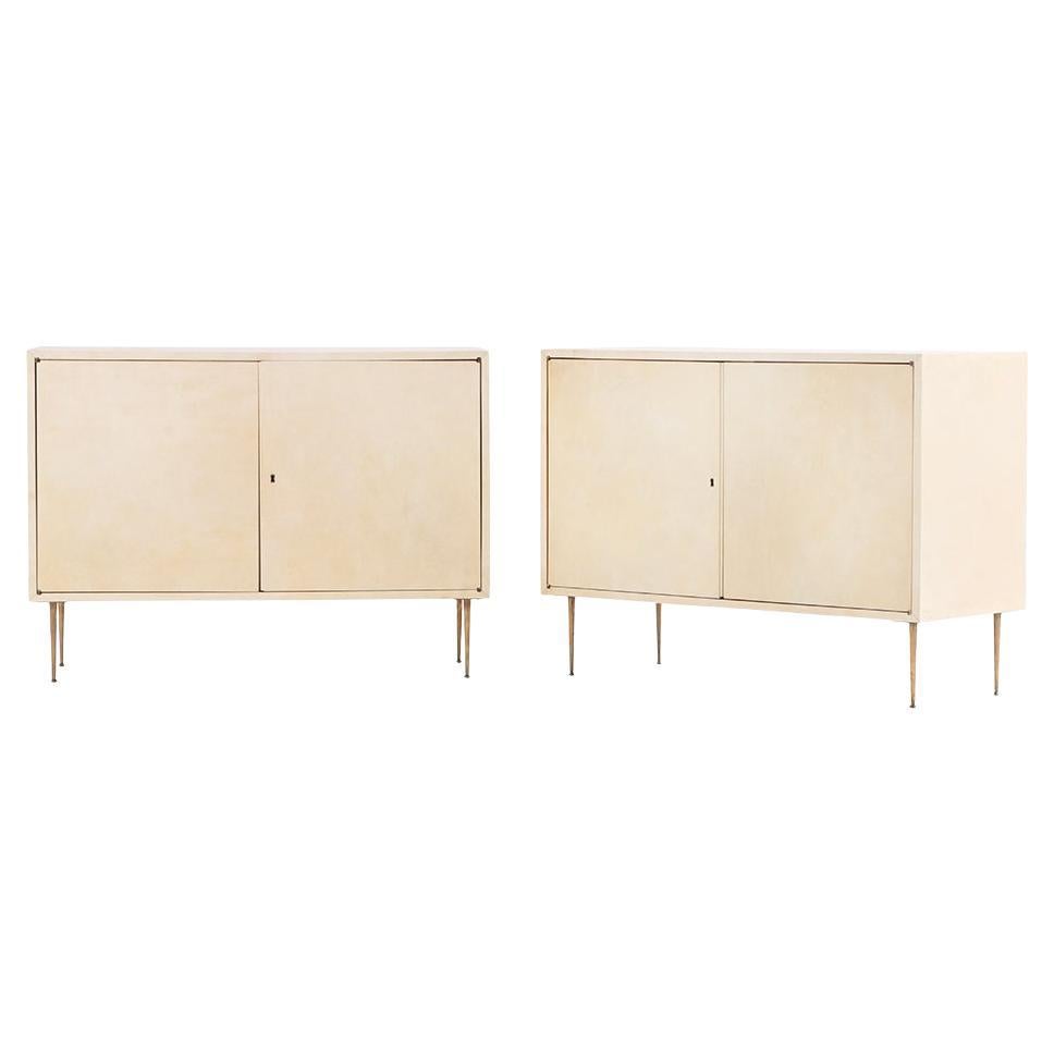 A Pair of MCM Pergamino Covered Cabinets / Nightstands, C. 1950.