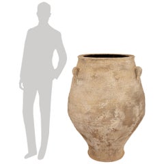 A pair of Mediterranean 19th century patinated Terra Cotta olive jars