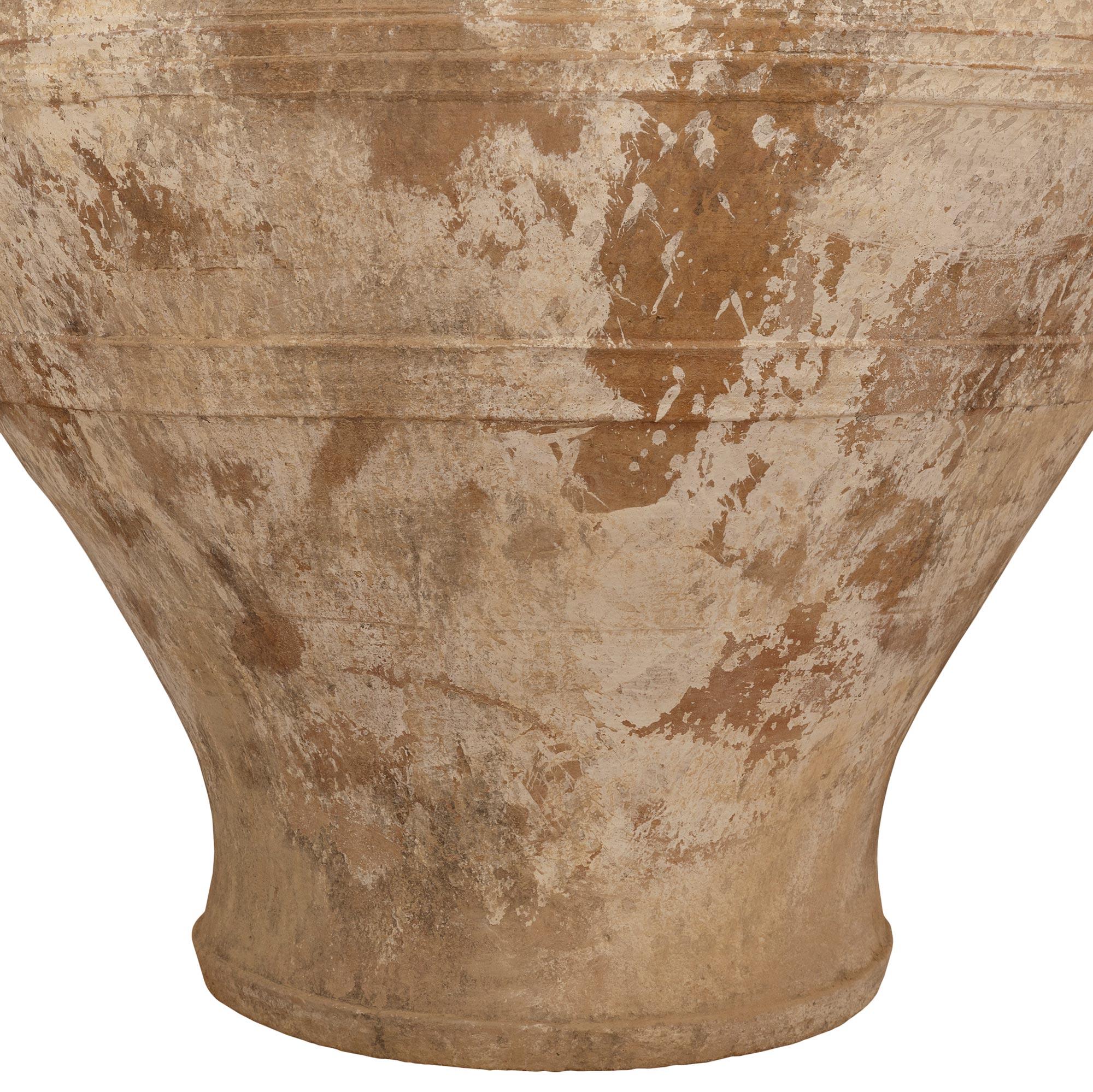 A pair of Mediterranean 19th century patinated Terra Cotta olive jars For Sale 1