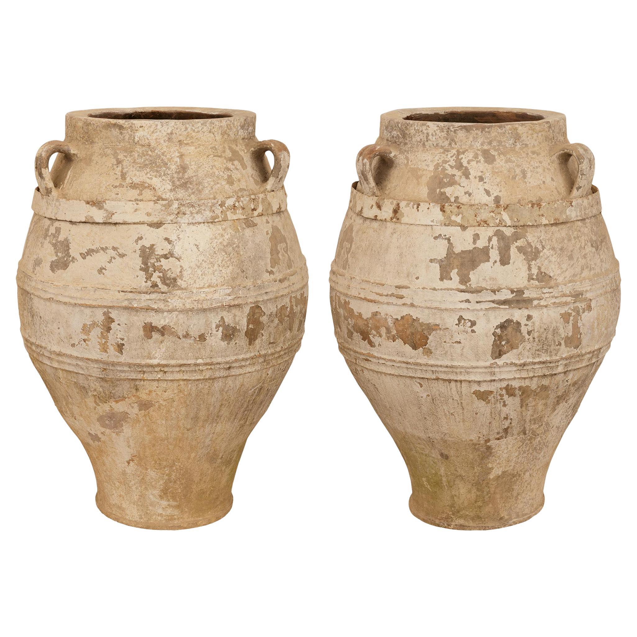 A pair of Mediterranean 19th century patinated Terra Cotta olive jars