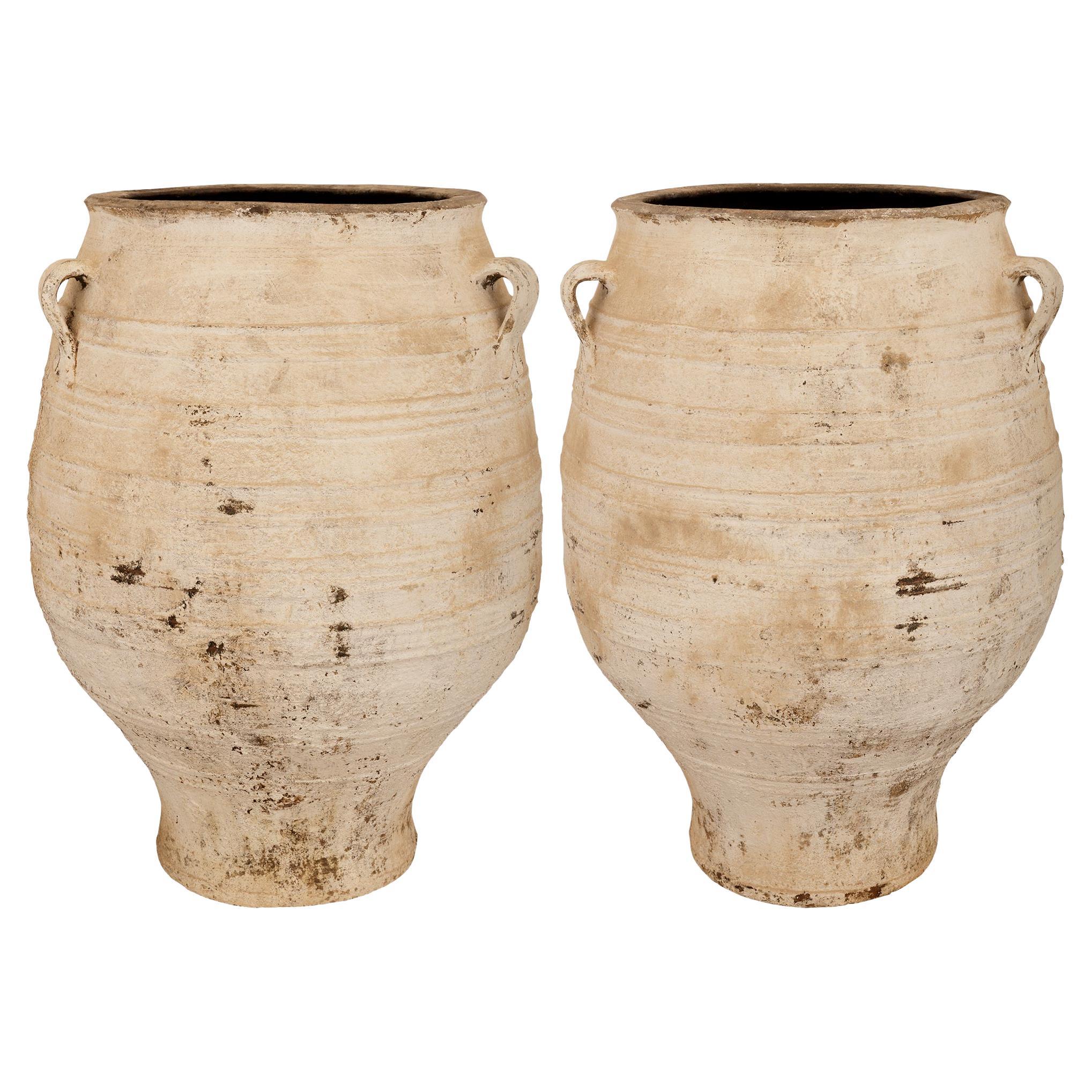 A pair of Mediterranean 19th century patinated Terra Cotta olive jars