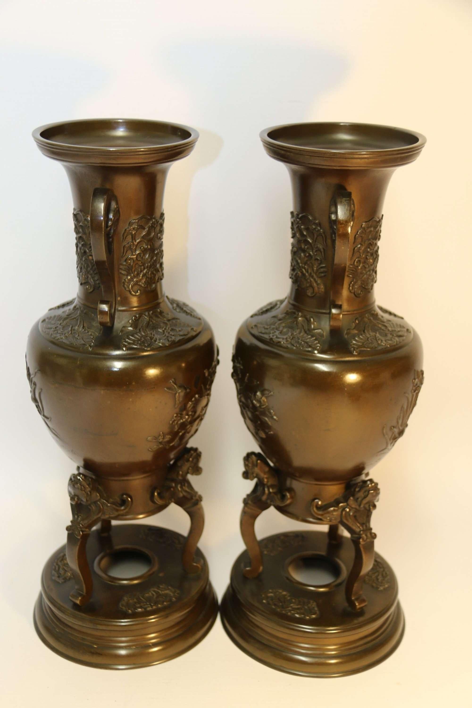 A pair of Meiji Period Japanese bronze vases.

This fine pair of late 19th century Japanese bronze vases are well proportioned and of a good decorative size. They are beautifully decorated with panels on one side with magpies amongst irises and