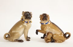 A Pair of Meissen Porcelain Pug Dogs with Gilt Bell Collars & One w/ Child