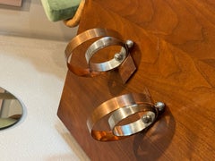 A pair of metal and copper Art Deco bookends by Walter Von Nessen circa 1930s